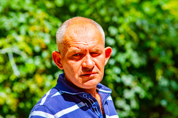 istock Portrait of a gray-haired middle-aged man. 1168848964