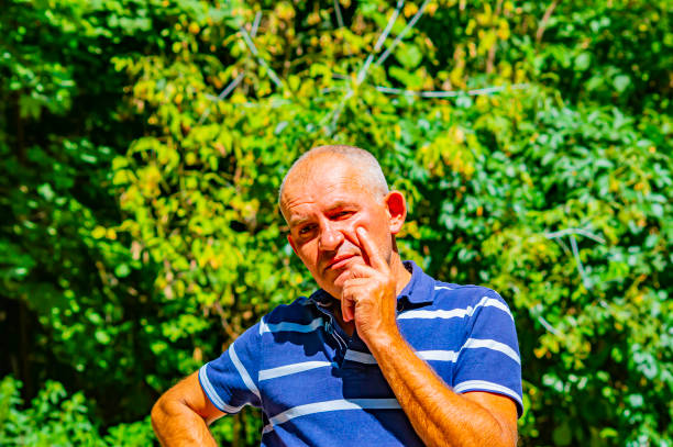 istock Portrait of a gray-haired middle-aged man. 1168848979