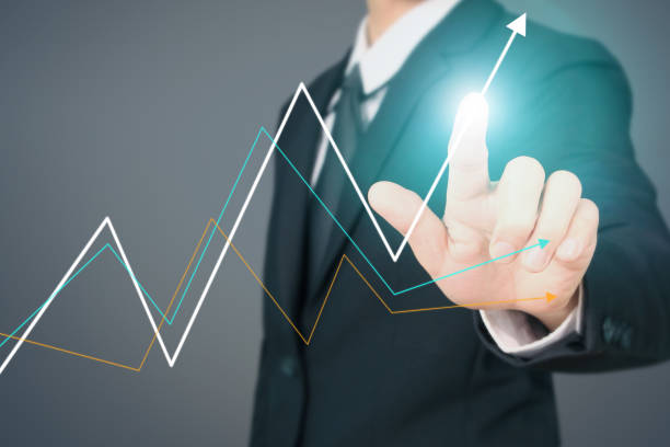 istock Businessman  Touching stock Graph Indicating Growth 1168849931