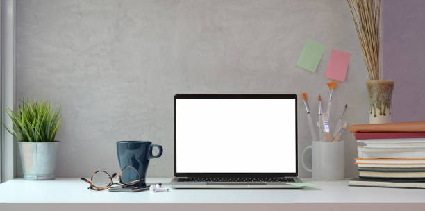 istock Creative artist studio with blank screen laptop and painting tools 1168856568