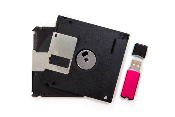 istock USB Flash drive and floppy disk isolated on white background 1168863153