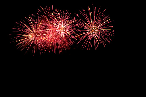 The colorful of fireworks showing on dark sky at night time for special celebration day with black background