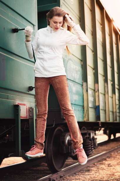 istock Smiling young woman on the train 1168866372