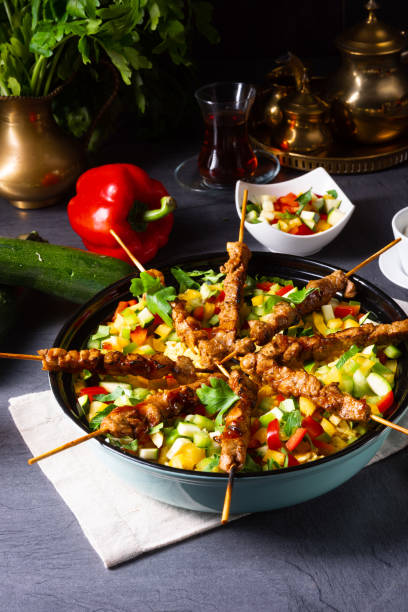 istock Lamb skewers with curry rice and different vegetables 1168867963