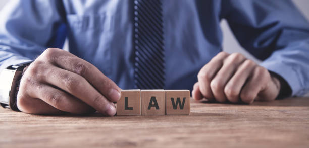 istock Hand holding wooden cube. Law concept 1168868010