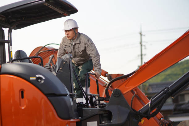 istock Male worker in an excavator at a construction site 1168869432