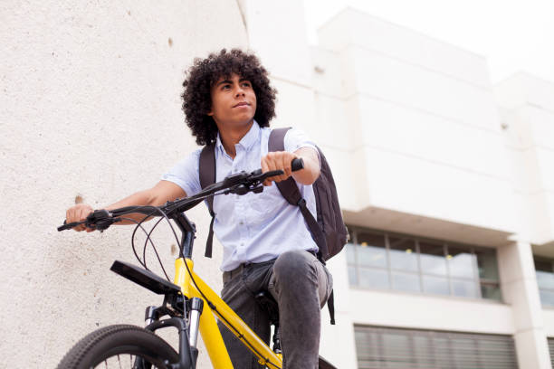 istock Young man moving to work by bicycle 1168869601