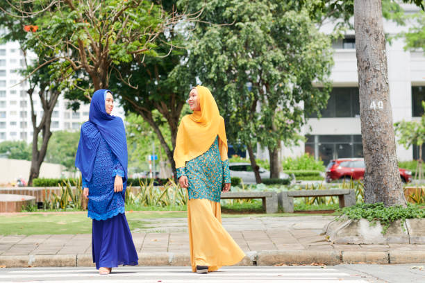 istock Muslim women crossing road 1168869814
