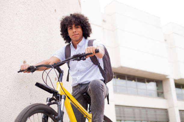istock Young man moving to work by bicycle 1168870686