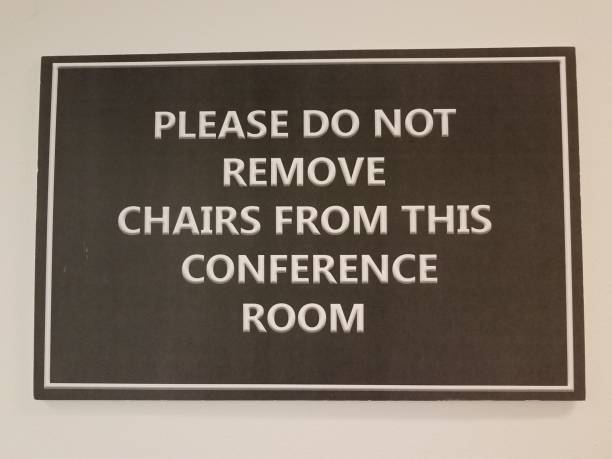 istock black please do not remove chairs from this conference room sign 1168872641