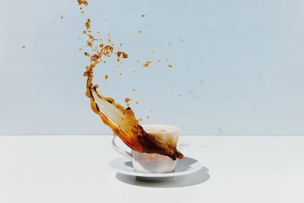 istock Splashing black coffee in white cup 1168872725