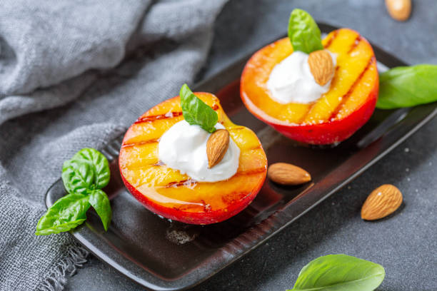 istock Fried peaches with yogurt, honey and almonds. 1168879735