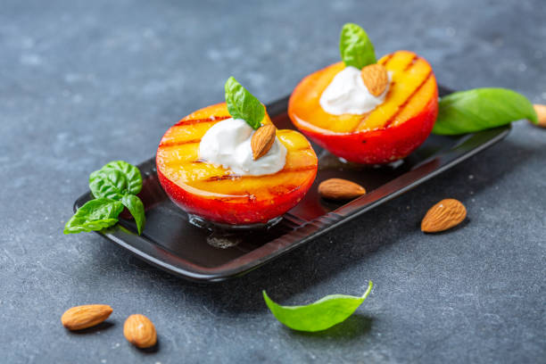 istock Grilled peach with honey, yogurt and almonds. 1168879791