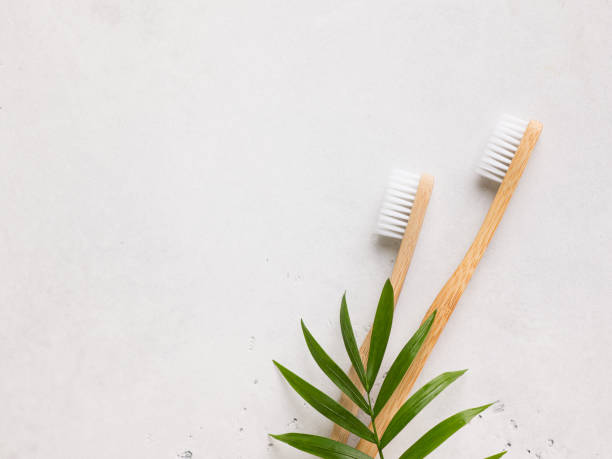 Zero waste and minimalism concept. Wooden bamboo thoothbrush ecological theme on white background Zero waste and minimalism concept. Wooden bamboo thoothbrush ecological theme on white background, copy space, top view toothbrush stock pictures, royalty-free photos & images