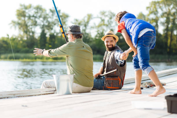istock Men feeling happy while having family fishing 1168883578