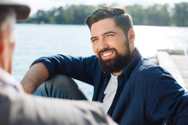 istock Handsome dark-haired man listening to his father 1168883638