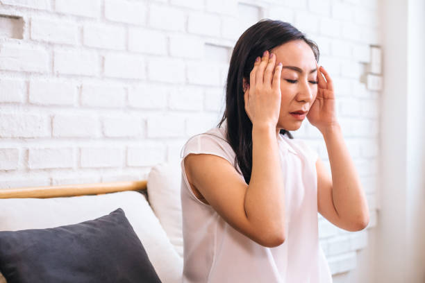 istock Middle aged Asian female in depression 1168885391