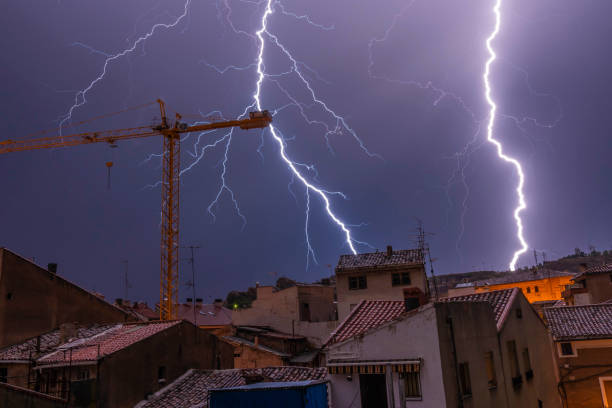 istock Panoramic view of an old village during a storm with lightnings and thunders - Image 1168885417