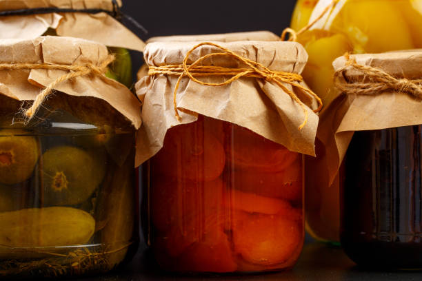 istock glass bottle with preserved food on black background - Image 1168886672