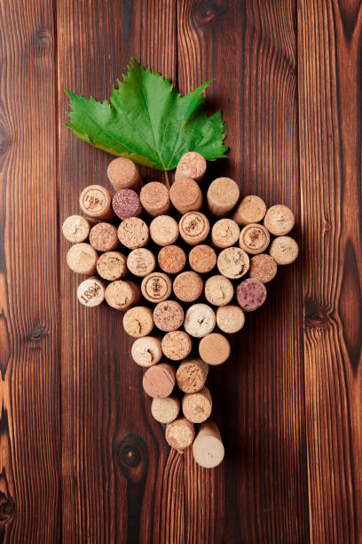 istock wine corks, grapevine, free copy space on wooden background - Image 