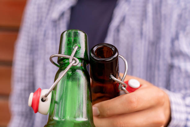 istock two guys clink bottle glass at the party, weekend celebration 1168888549
