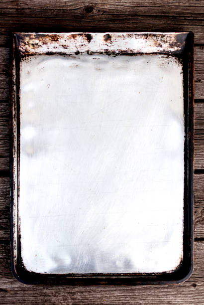 istock Old vintage baking pan and tins on wooden background. 1168889103