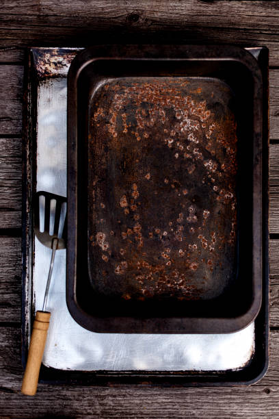 istock Old vintage baking pan and tins on wooden background. 1168889121