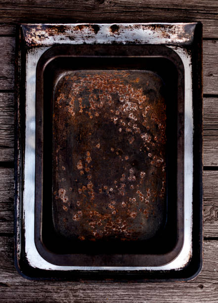 istock Old vintage baking pan and tins on wooden background. 1168889170