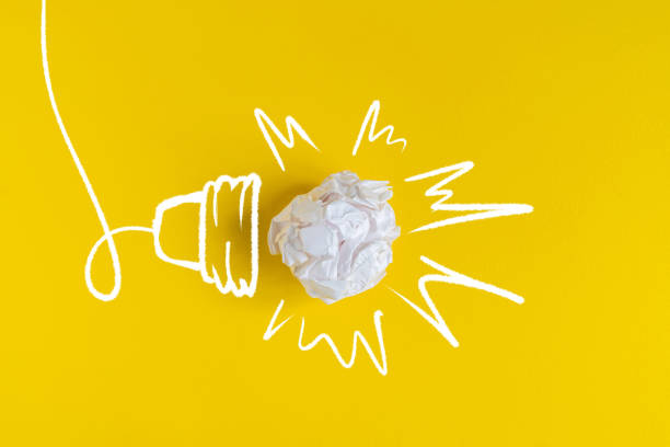istock one light bulb made of paper ball on color surface. creative ideas 1168889254