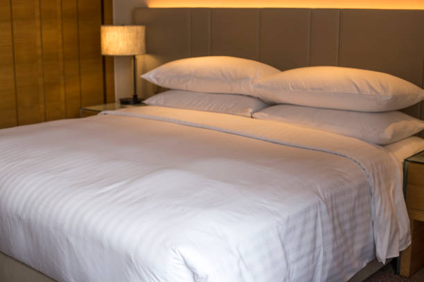 White bedding and pillow in hotel room