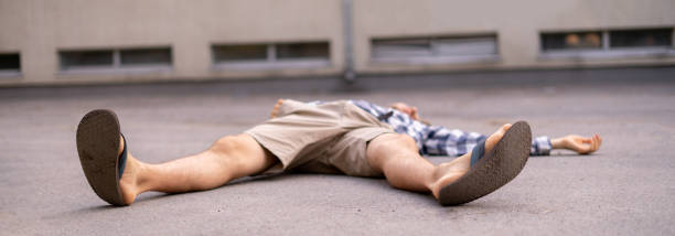 istock man on the ground, got injury outdoors, fall down 1168890418