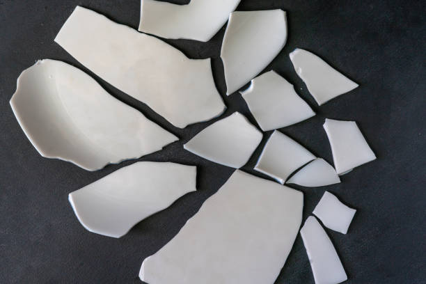 istock many white pieces of crashed dish tableware on the floor 1168890514