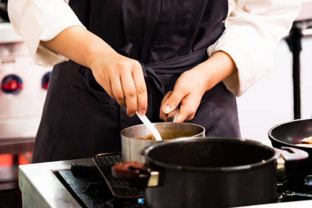 istock Chef cooking, Chef preparing food in the kitchen, closeup 1168890822