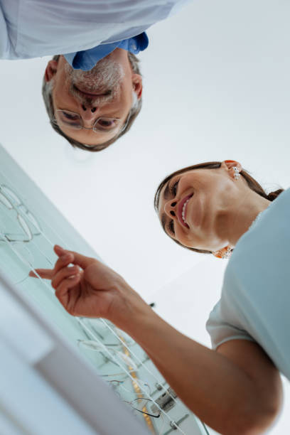 istock Low angle of a cheerful nice woman pointing with her finger 1168896846