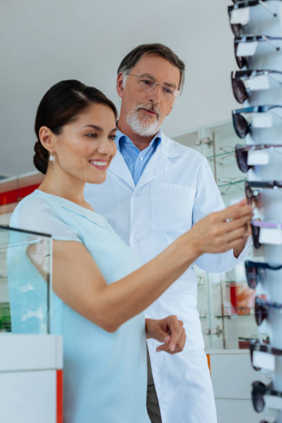 istock Joyful nice woman looking at the glasses 1168896849