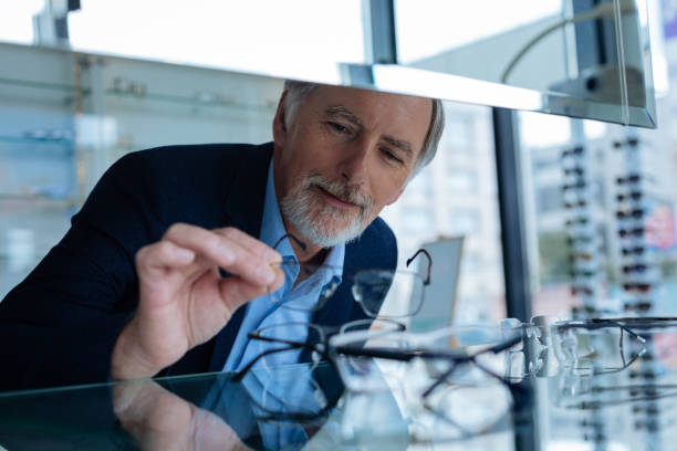 istock Nice bearded man holding eyeglasses in his hand 1168896870