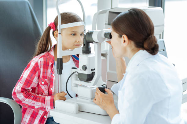istock Professional female doctor looking into the special device 1168896912