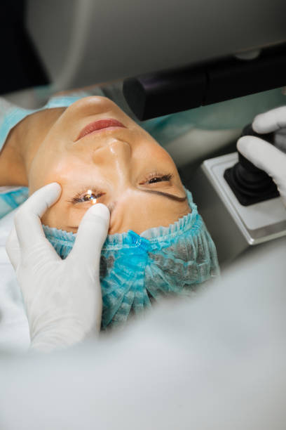 istock Professional skilled doctor touching his patients eye 1168897196