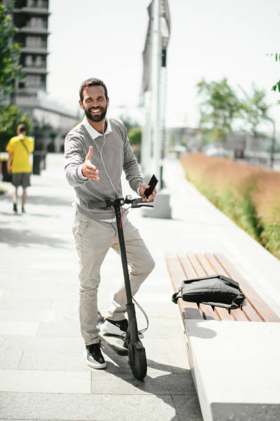 istock Businessman riding electric scooter 1168901955