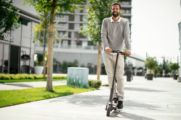 istock Businessman riding electric scooter 1168902323
