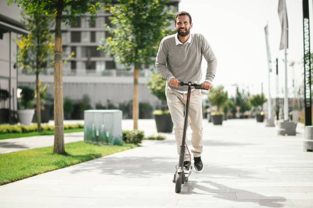 istock Businessman riding electric scooter 1168902563