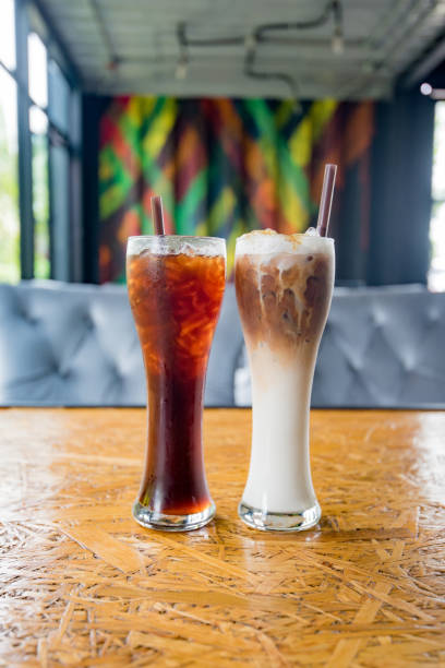 istock ice coffee on wooden background 1168903976