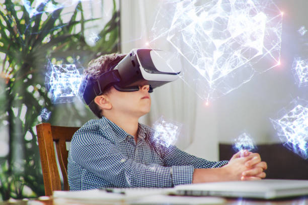 istock A boy in virtual glasses learning geometric shapes holograms. 1168904326