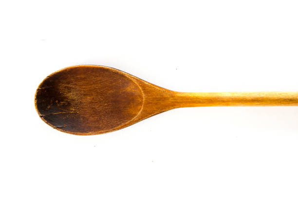 istock Wooden spoon on white background 1168904957