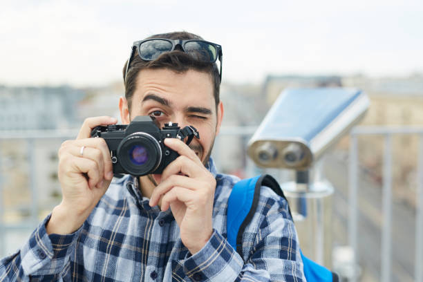 istock Young Tourist Taking Photos 1168909333