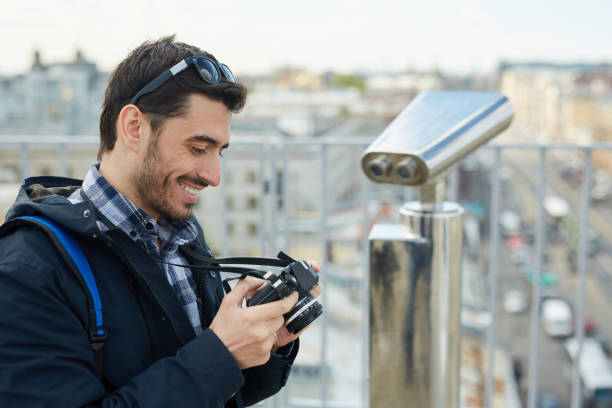 istock Tourist Looking at Camera Photos 1168909352