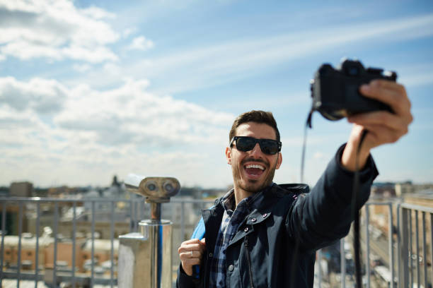 istock Excited Tourist Taking Selfie on Rooftop 1168909378