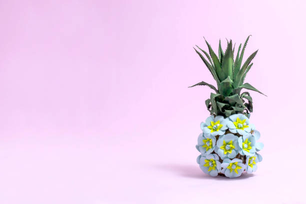 istock Pineapple decorated with paper flowers 1168911533