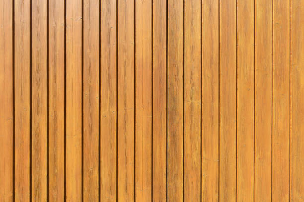 istock Honey-colored vertical wooden wall 1168911596