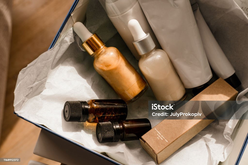 Beauty box set of natural cosmetics Beauty box set, bottles of natural cosmetics. Blogger skincare, face, hair and body essentials, salon treatments. Overhead, minimalism package, branding mockup Merchandise Stock Photo